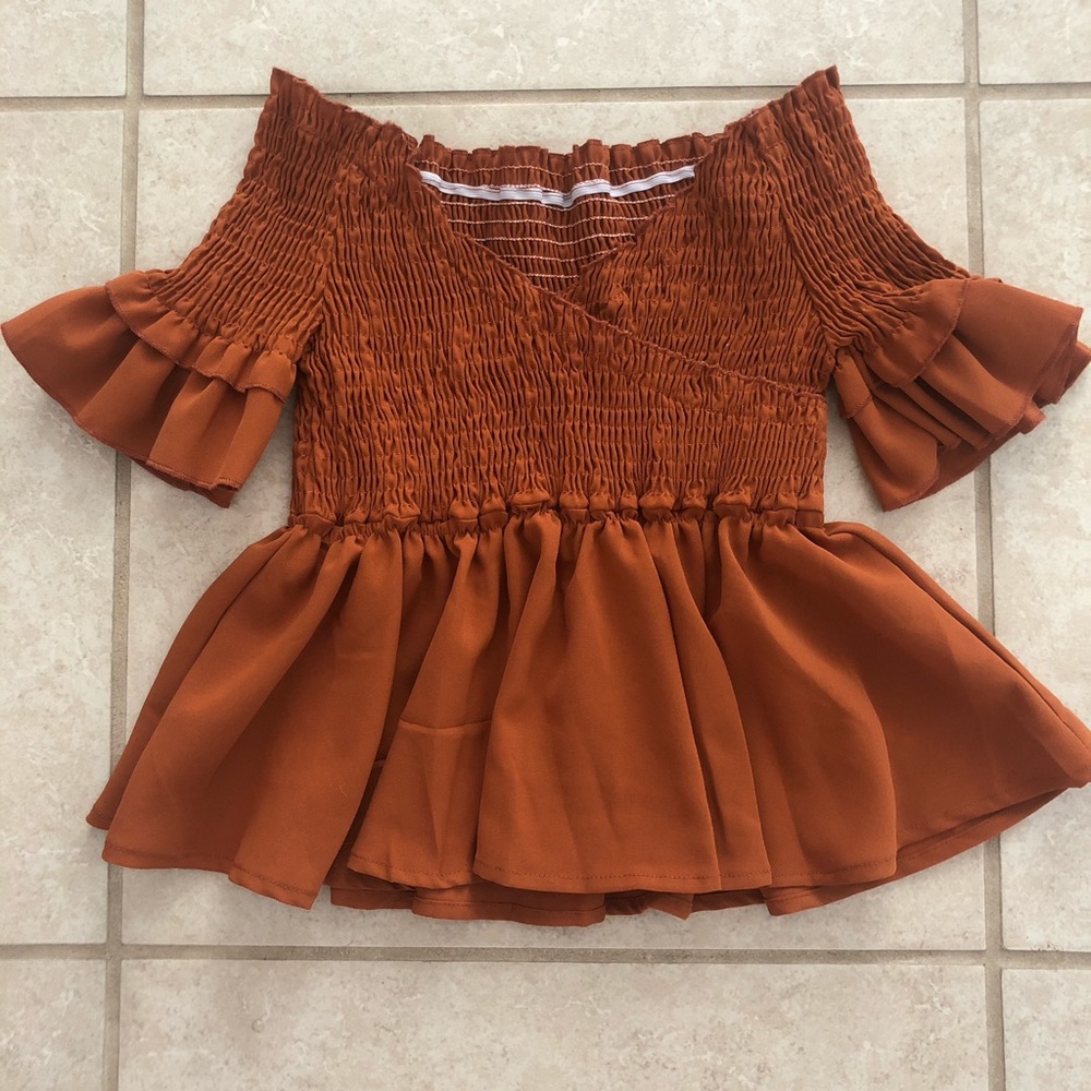 Stretch off the shoulder shirt/in burnt orange